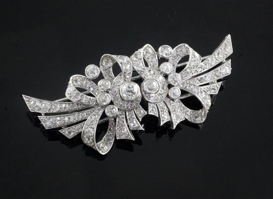 A 1940s/1950s white gold? and diamond double clip brooch, 6cm.